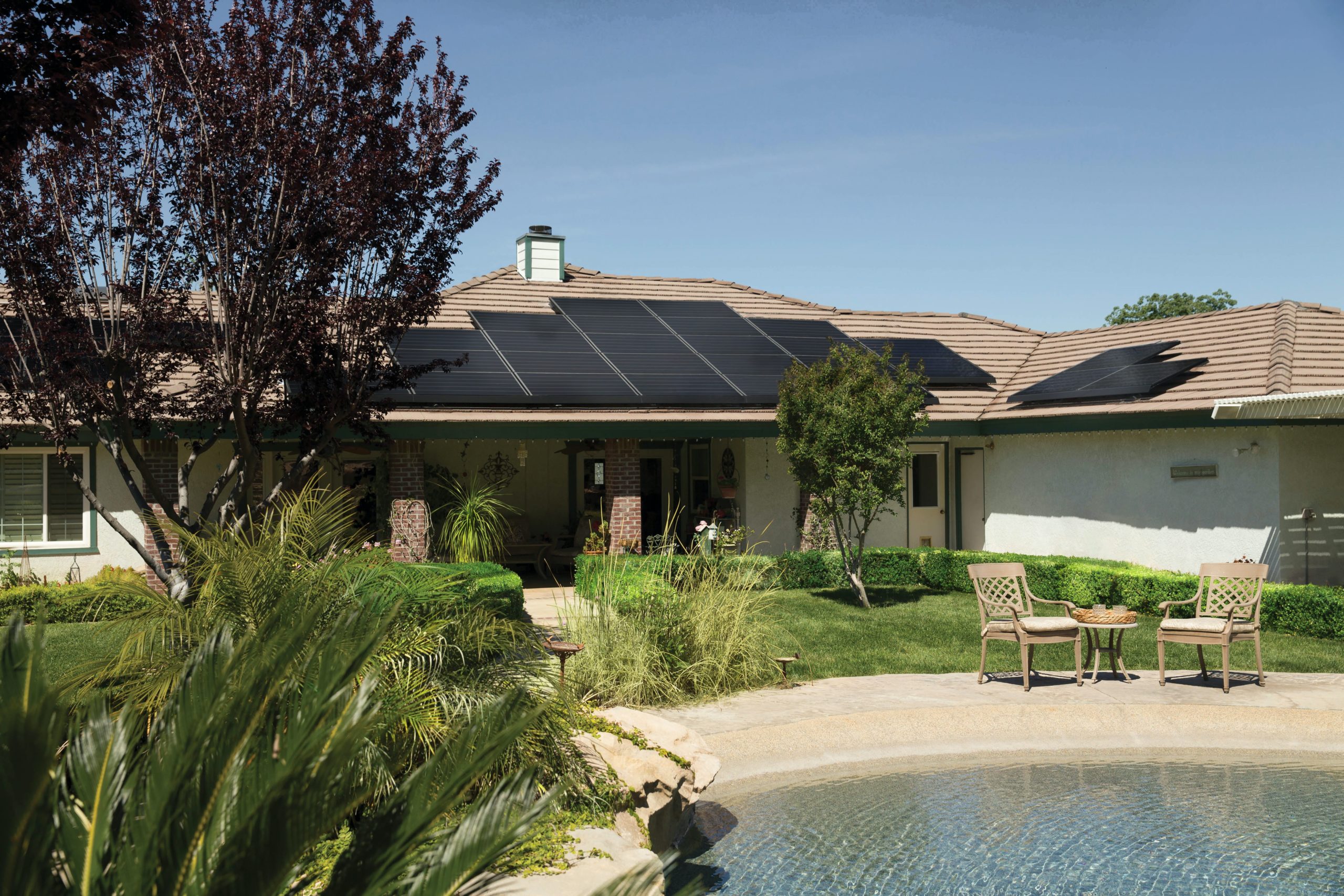 A residential home with solar panels installed on the roof, demonstrating the integration of solar energy solutions for sustainable and efficient home power generation.